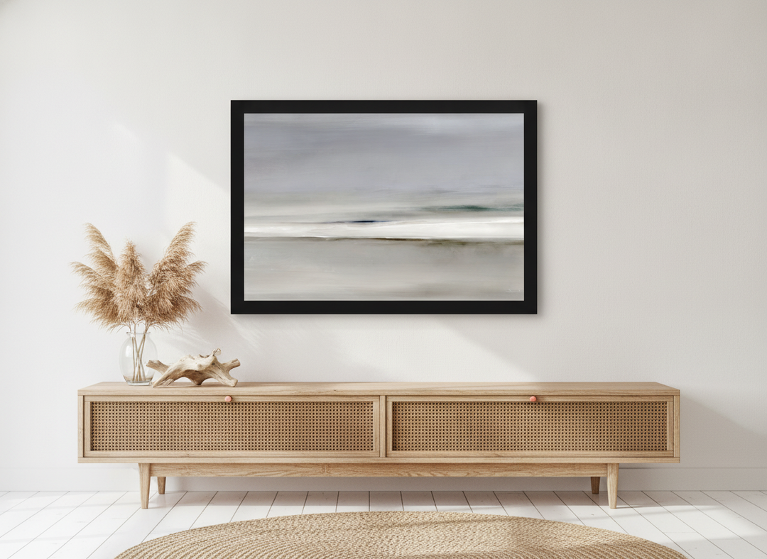 Modern wall art print standing on a sideboard in a coastal bedroom