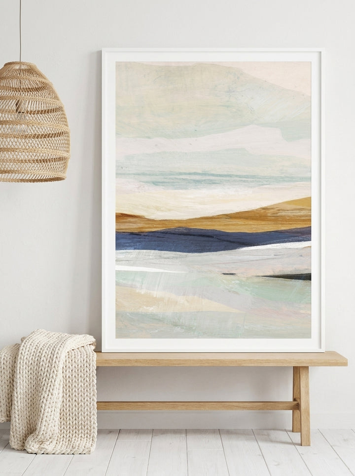 Modern wall art print standing on a bench in a bright Scandinavian home office