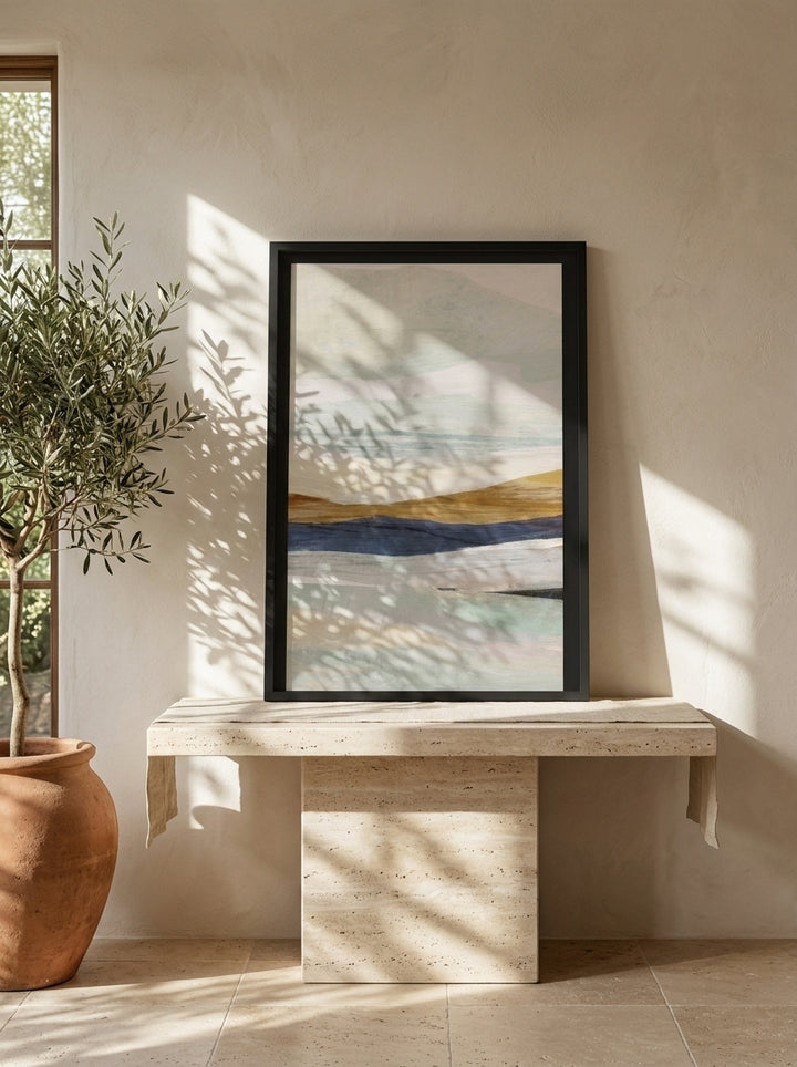 Modern wall art print standing on a console in a Mediterranean living room