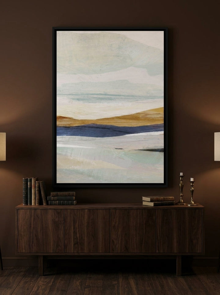 Canvas wall art with a black surround styled on the wall in a moody living room