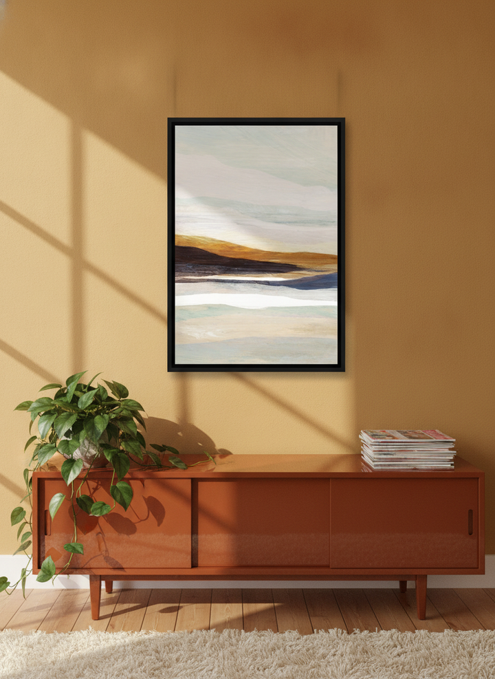 Canvas wall art with a black surround styled on the wall in a retro 70s living room