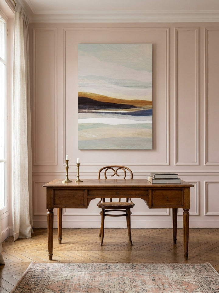Stretched canvas wall art styled on the wall in a Parisian home office