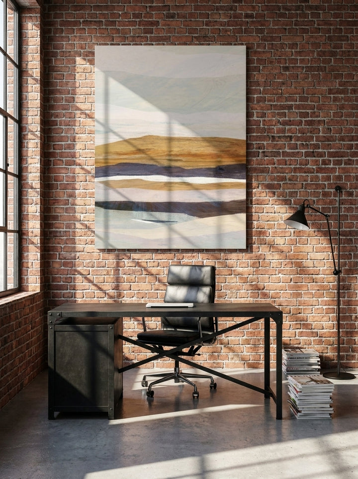Stretched canvas wall art styled on the wall in an industrial loft home office