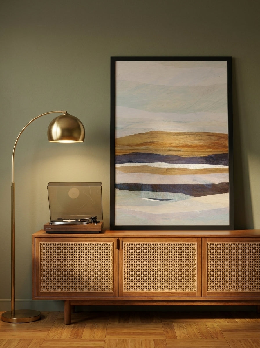 Modern wall art print standing on a sideboard in a mid-century living room