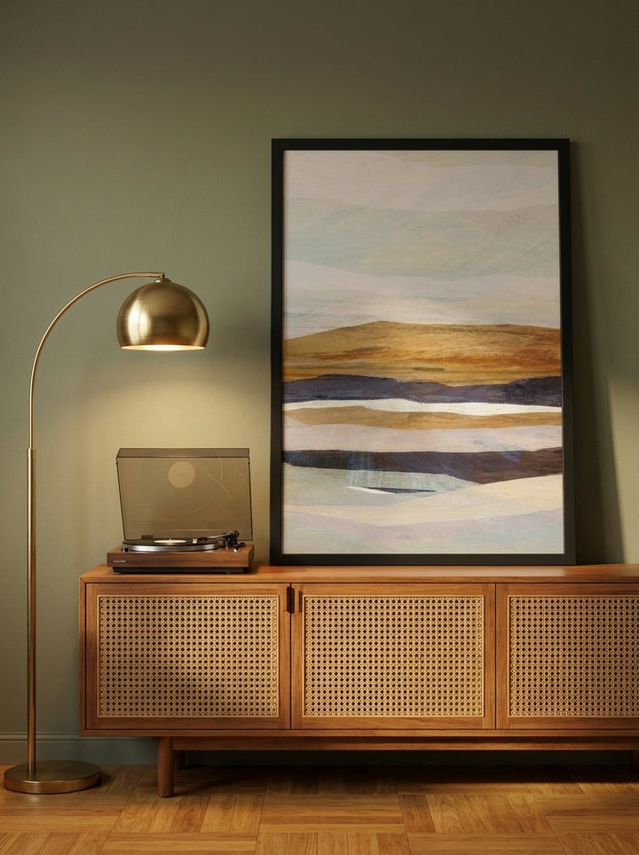 Modern wall art print standing on a sideboard in a mid-century living room