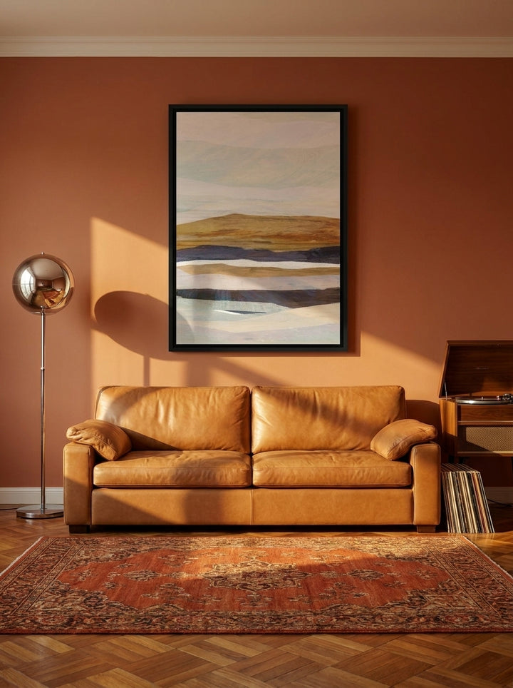 Canvas wall art with a black surround styled on the wall in a retro 70s living room