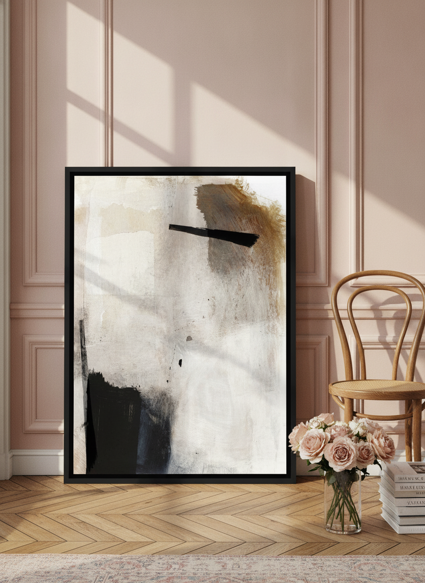 Canvas wall art with a black surround leaning against the wall in a Parisian living room
