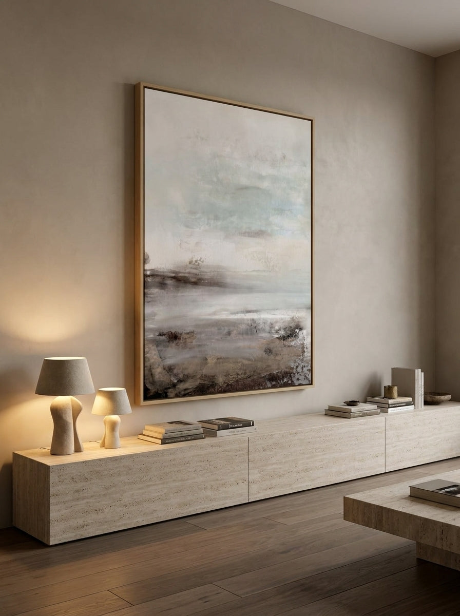 Oversized statement canvas wall art with a natural timber surround styled on the wall in a luxe living room