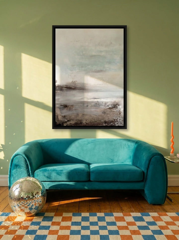 Canvas wall art with a black surround styled on the wall in a colourful eclectic living room