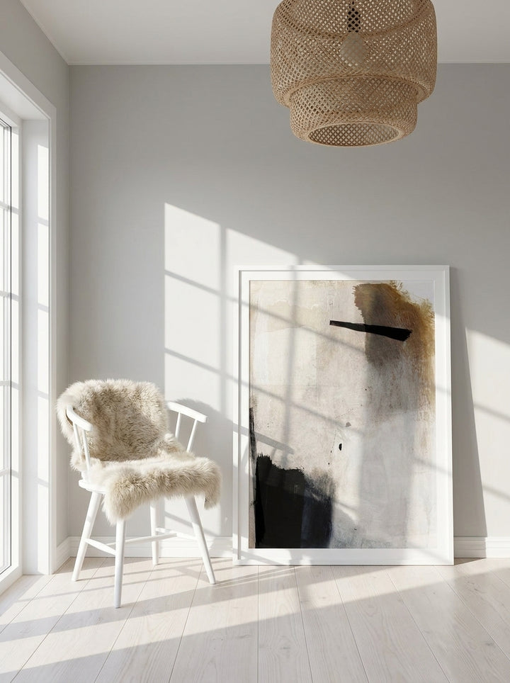 Modern wall art print leaning against the wall in a bright Scandinavian home office