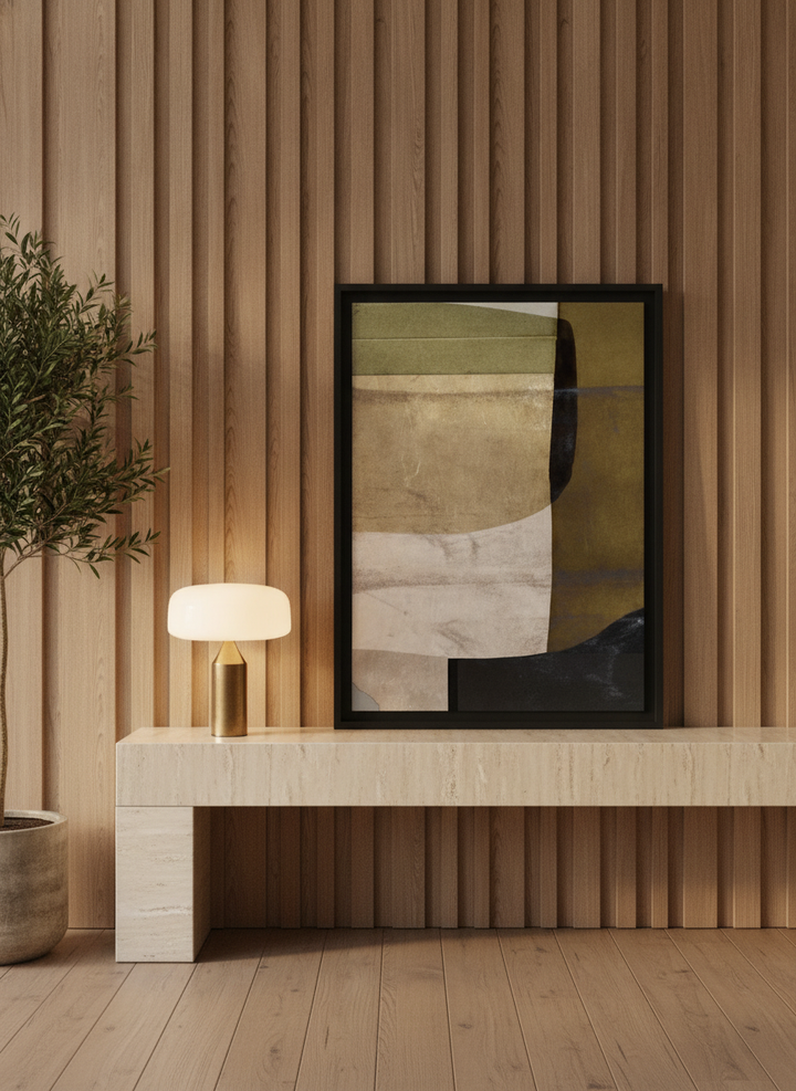 Modern wall art print standing on a console in a luxe bedroom
