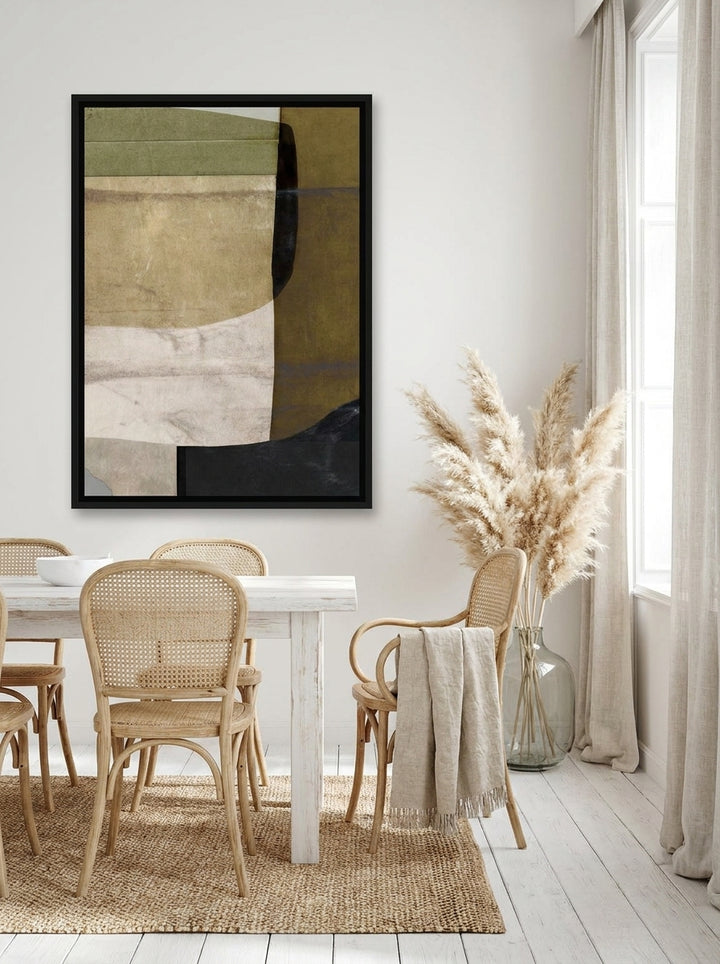 Oversized statement canvas wall art with a black surround styled on the wall in a coastal dining room
