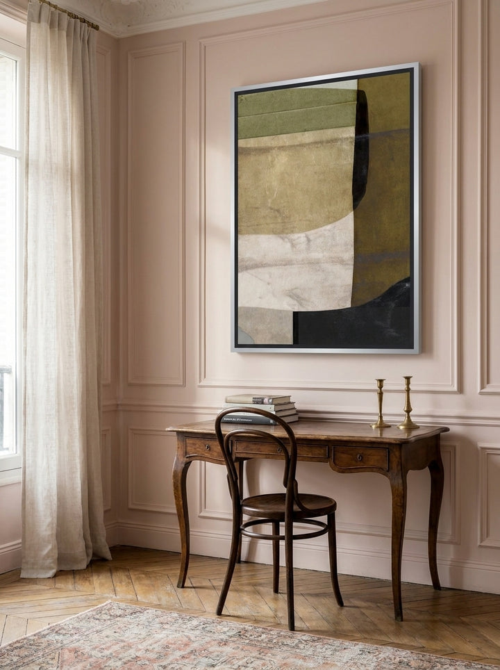 Canvas wall art with a silver leaf surround styled on the wall in a Parisian home office