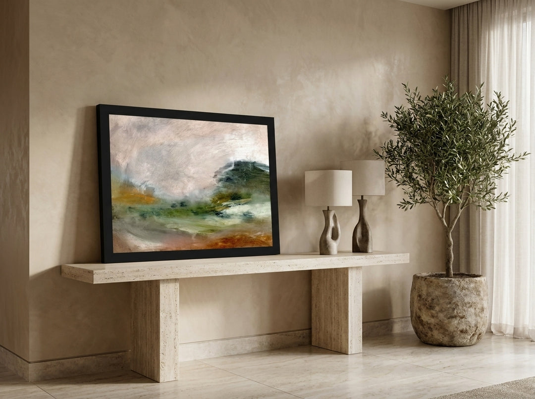 Modern wall art print standing on a console in a luxe living room
