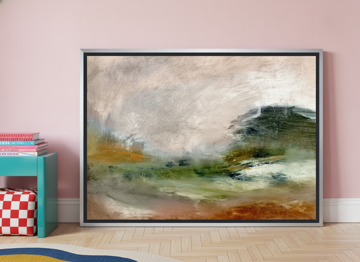 Canvas wall art with a silver leaf surround leaning against the wall in a colourful eclectic home office