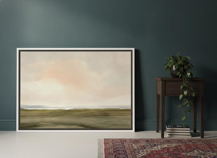 Canvas wall art with a white surround leaning against the wall in a moody bedroom