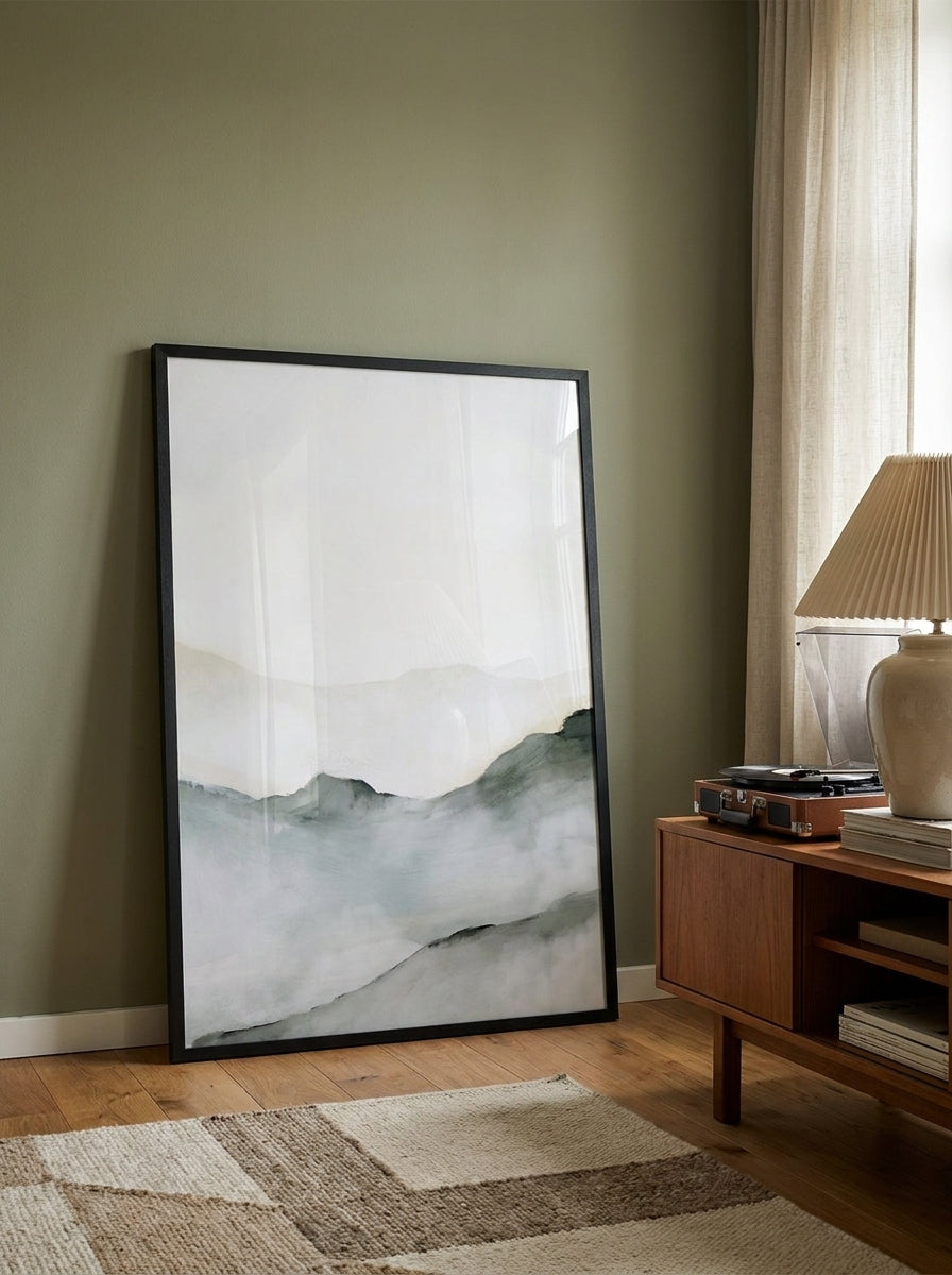 Oversized statement modern wall art print leaning against the wall in a mid-century dining room