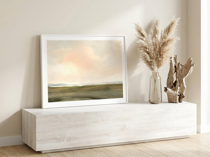 Modern wall art print standing on a console in a coastal home office
