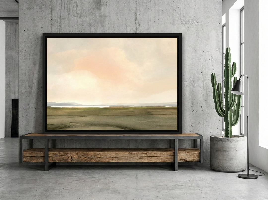 Canvas wall art with a black surround standing on a console in an industrial loft living room