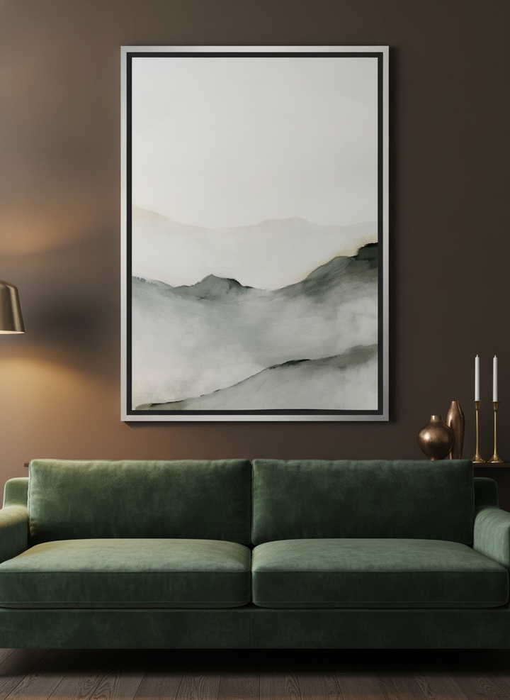 Oversized statement canvas wall art with a silver leaf surround styled on the wall in a moody living room
