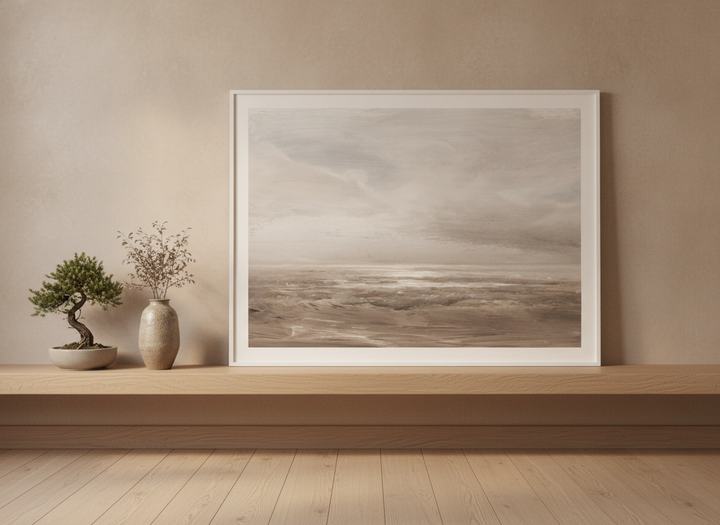 Modern wall art print standing on a shelf in a warm Japandi bathroom