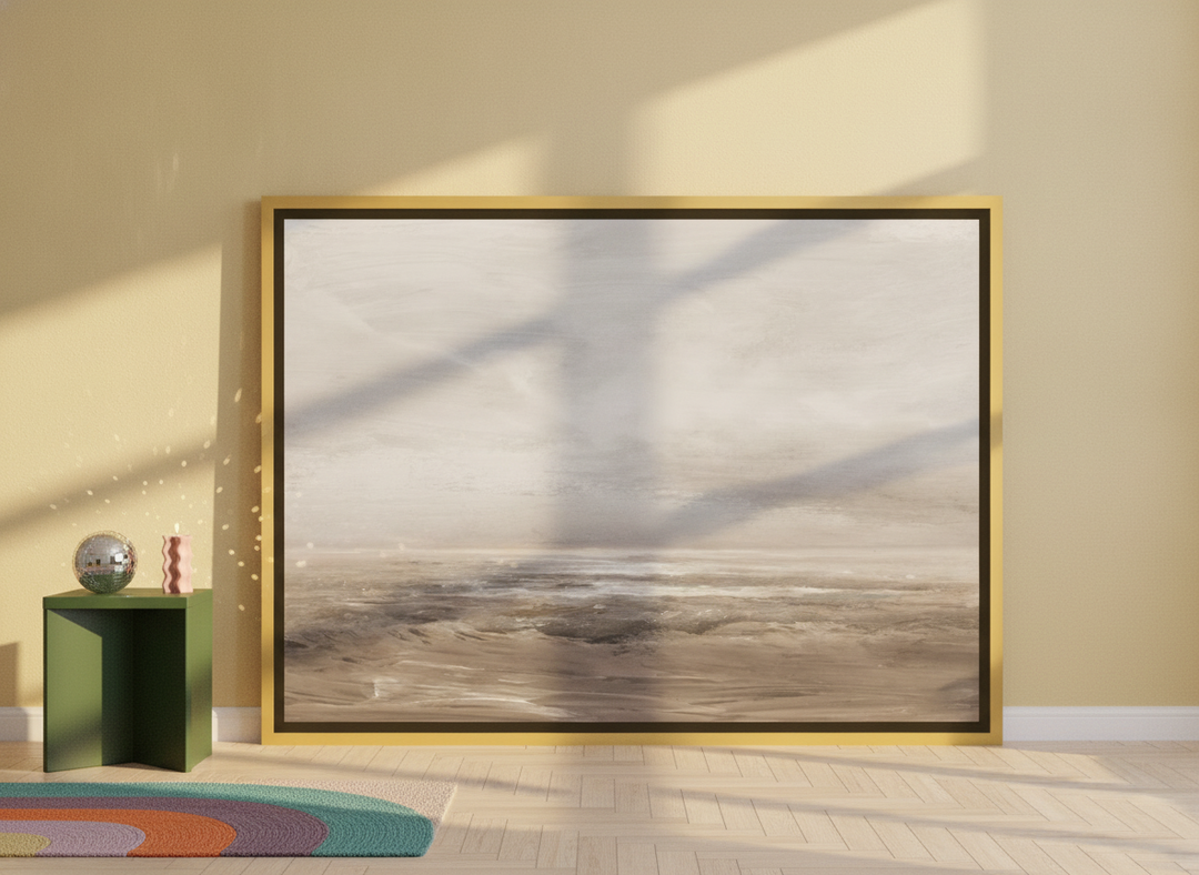 Oversized statement canvas wall art with a gold leaf surround leaning against the wall in a colourful eclectic living room