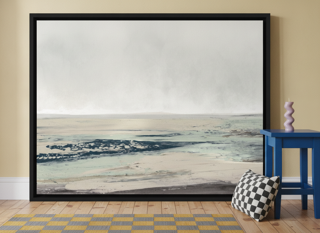 Canvas wall art with a black surround leaning against the wall in a colourful eclectic home office