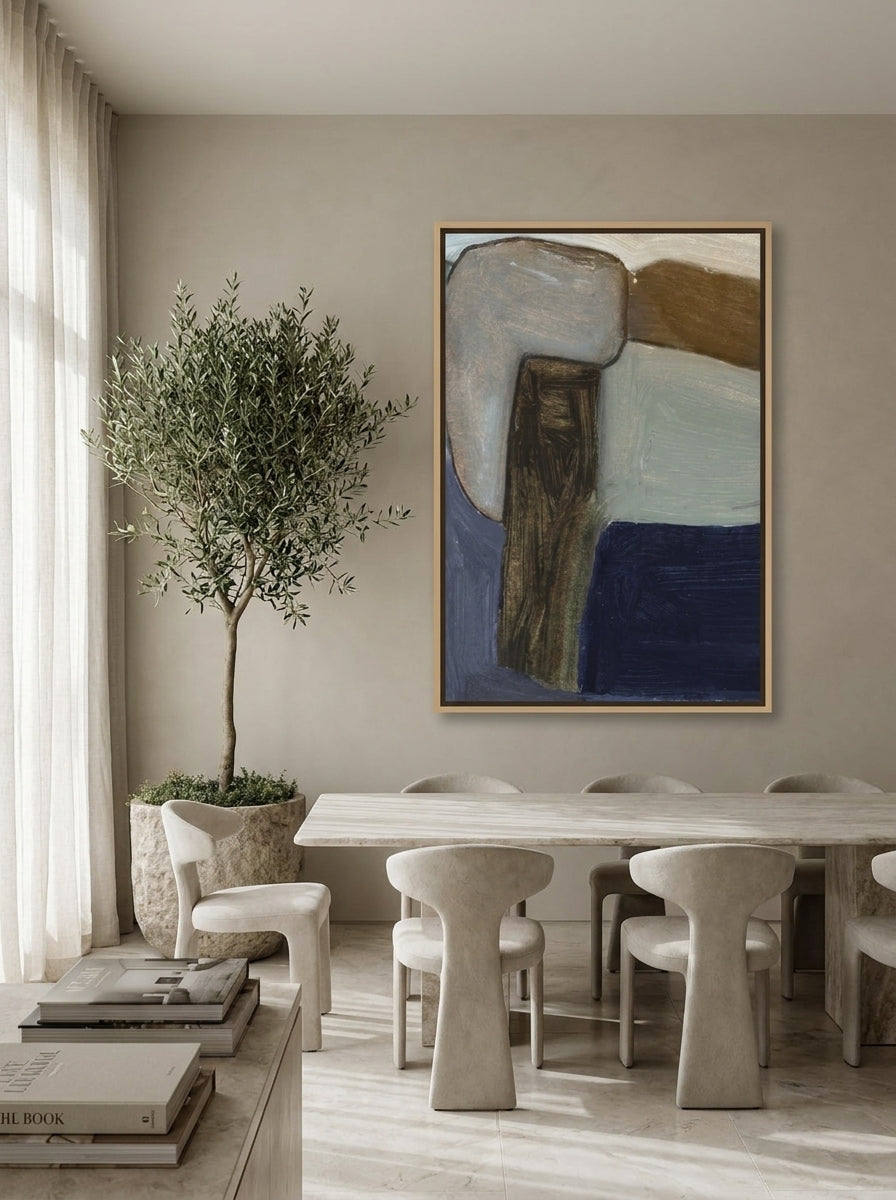 Oversized statement canvas wall art with a natural timber surround styled on the wall in a luxe dining room