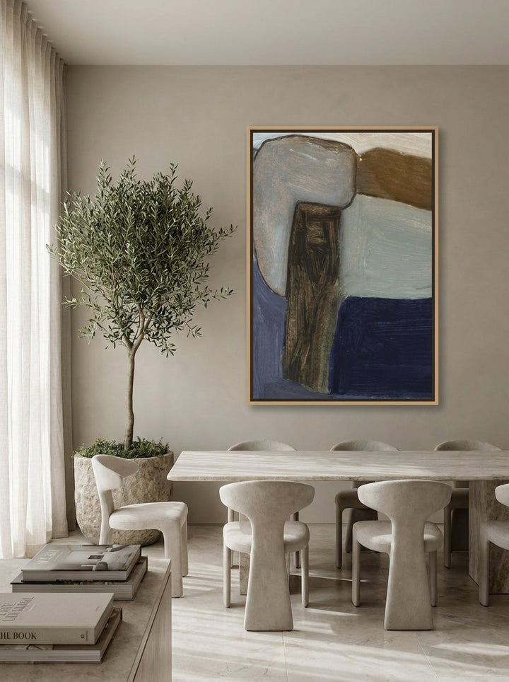 Oversized statement canvas wall art with a natural timber surround styled on the wall in a luxe dining room