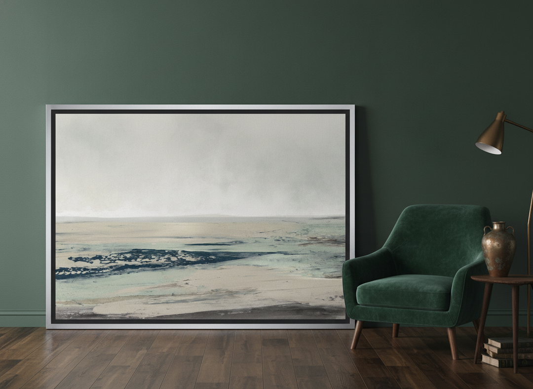 Canvas wall art with a silver leaf surround leaning against the wall in a moody bedroom