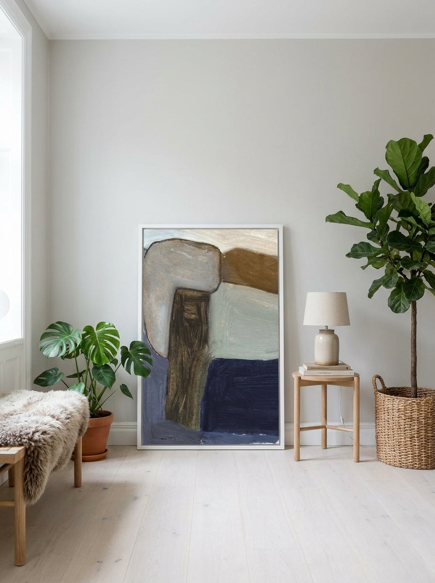 Modern wall art print leaning against the wall in a bright Scandinavian home office