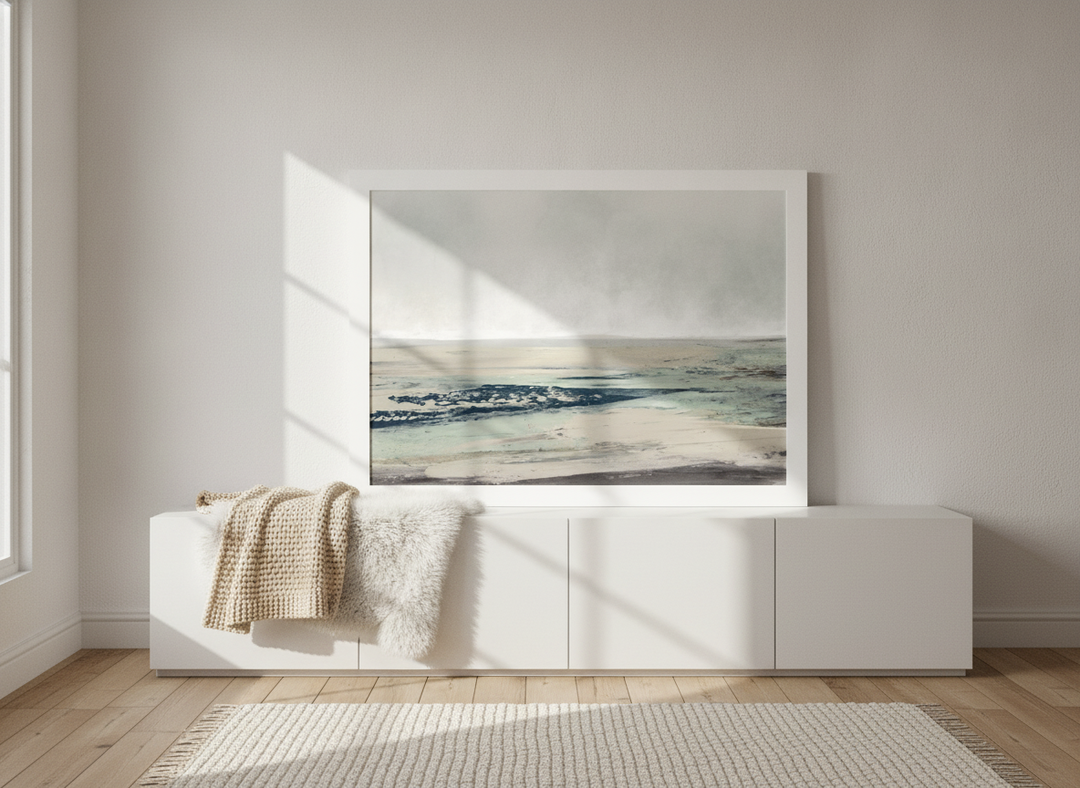 Modern wall art print standing on a sideboard in a bright Scandinavian bathroom