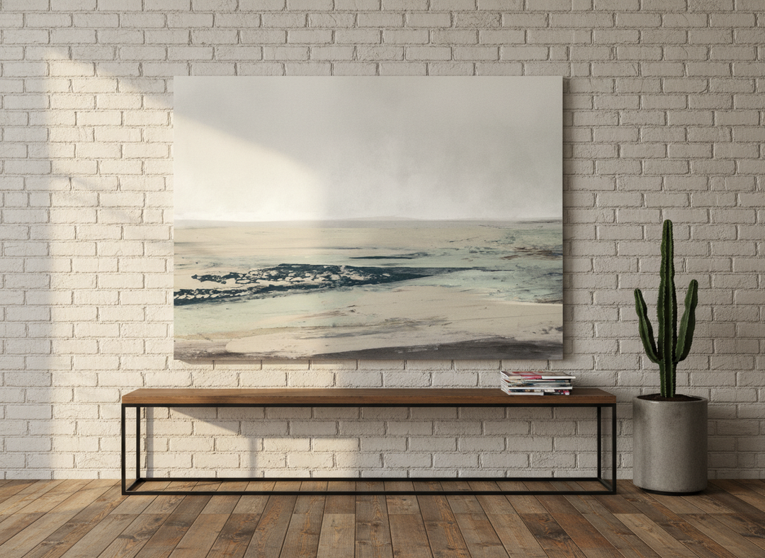Stretched canvas wall art standing on a console in an industrial loft bedroom