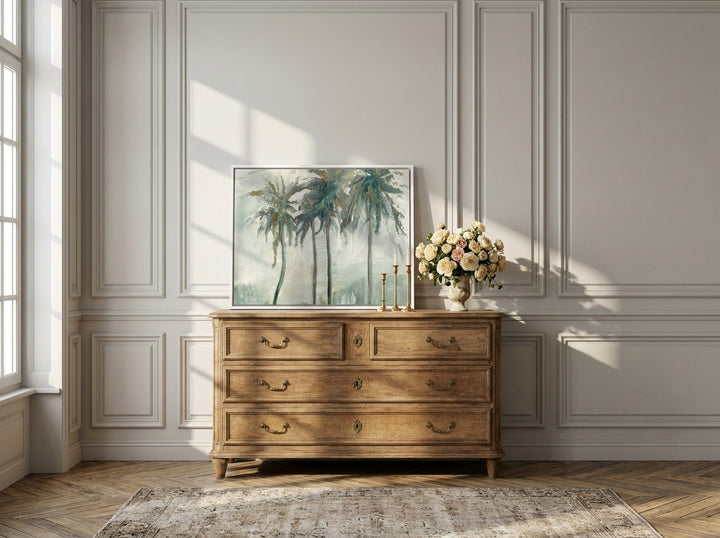 Canvas wall art with a white surround standing on a sideboard in a Parisian home office