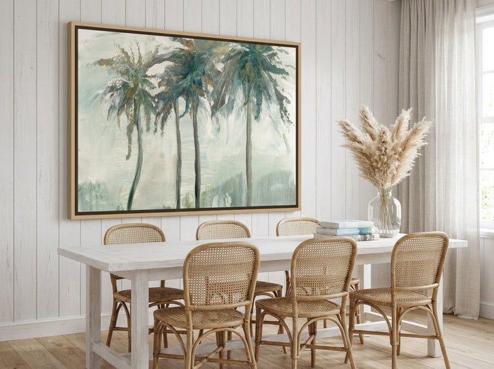 Oversized statement canvas wall art with a natural timber surround styled on the wall in a coastal dining room