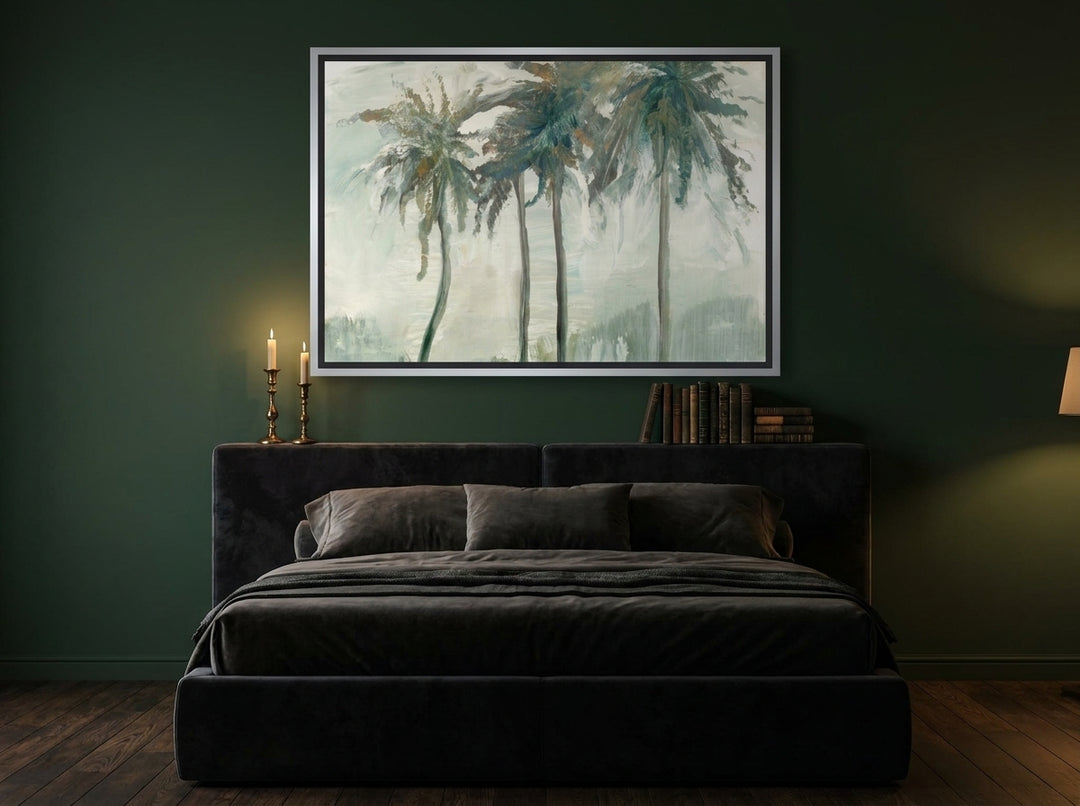 Canvas wall art with a silver leaf surround styled on the wall in a moody bedroom