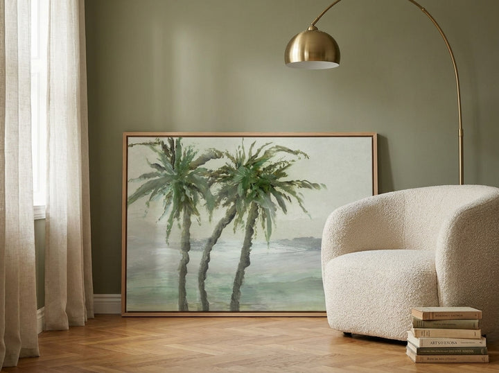 Canvas wall art with a natural timber surround leaning against the wall in a mid-century bedroom