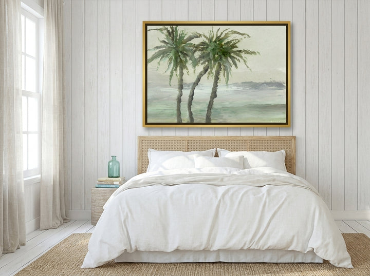 Oversized statement canvas wall art with a gold leaf surround styled on the wall in a coastal bedroom