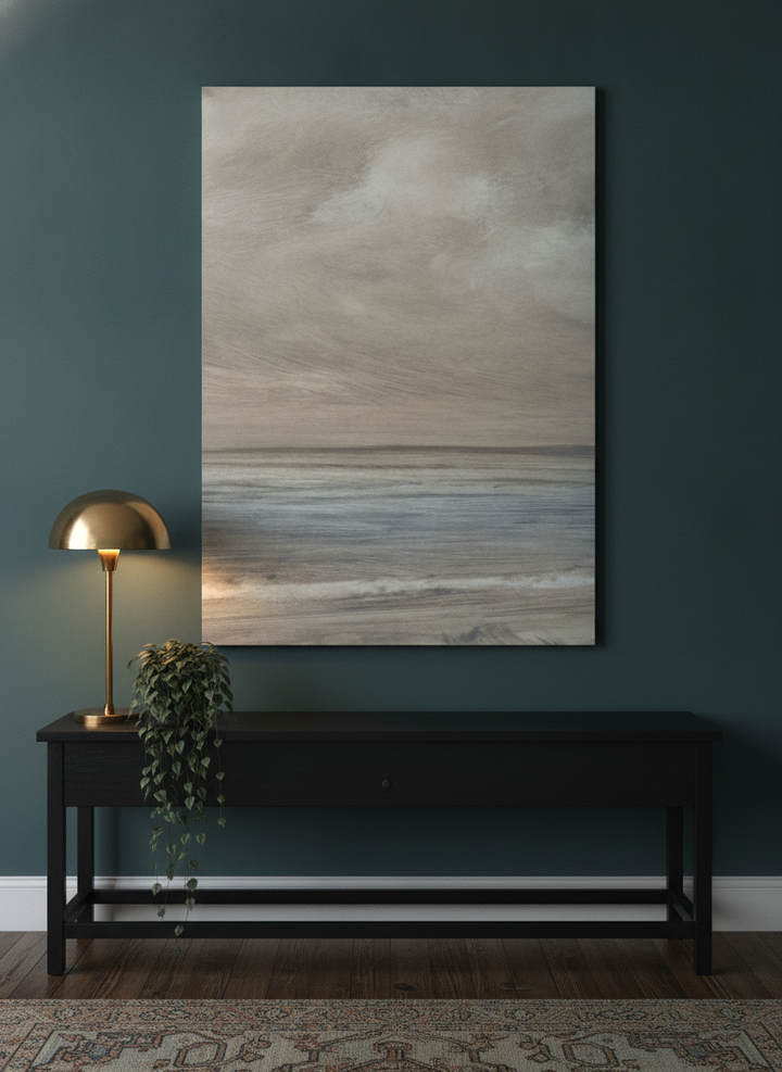 Stretched canvas wall art standing on a console in a moody bedroom