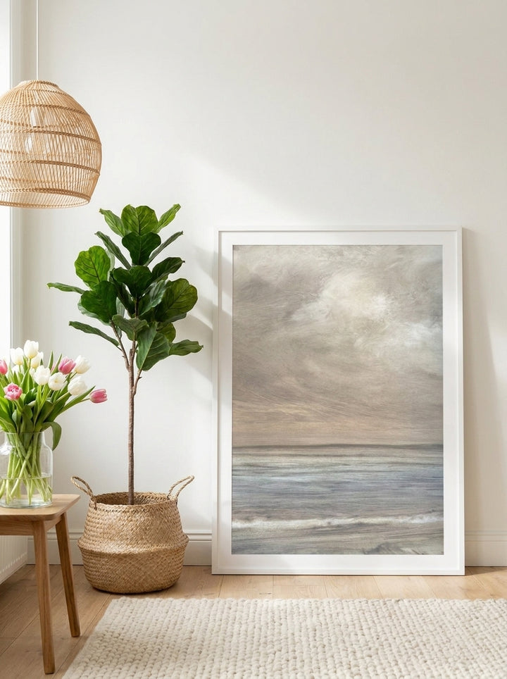 Modern wall art print leaning against the wall in a bright Scandinavian bathroom