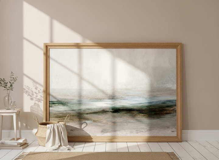 Oversized statement modern wall art print leaning against the wall in a coastal dining room