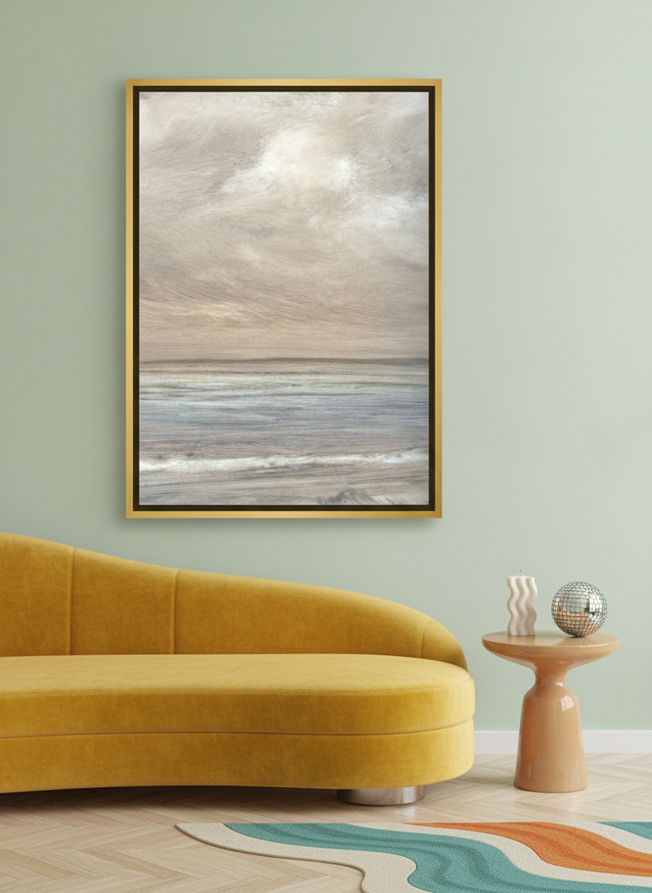 Canvas wall art with a gold leaf surround styled on the wall in a colourful eclectic living room