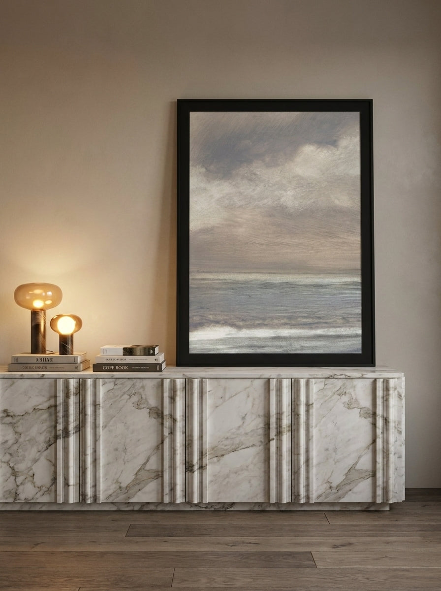 Modern wall art print standing on a sideboard in a luxe dining room