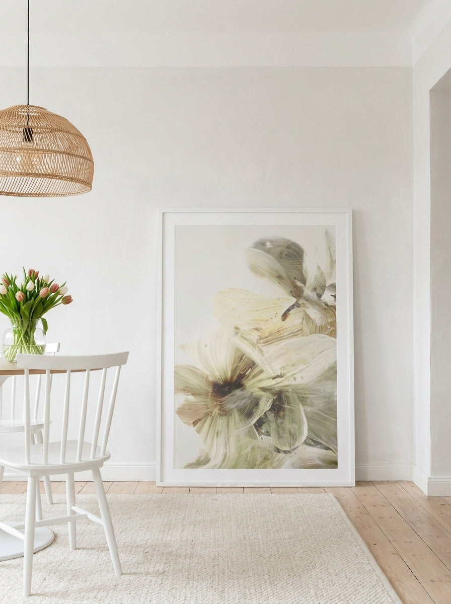 Oversized statement modern wall art print leaning against the wall in a bright Scandinavian dining room