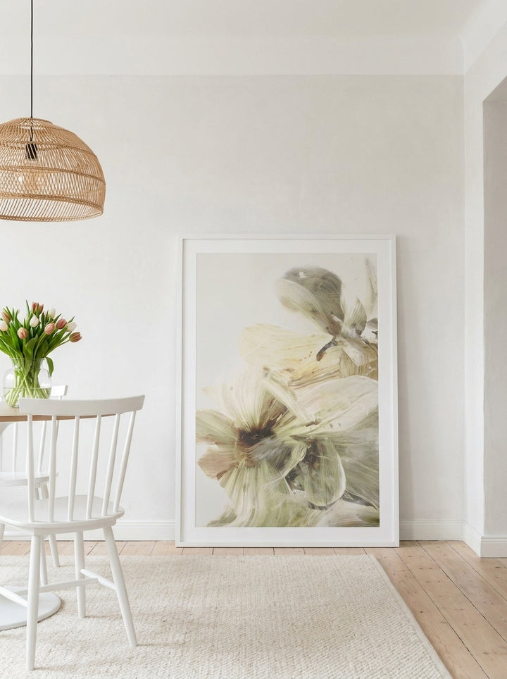 Oversized statement modern wall art print leaning against the wall in a bright Scandinavian dining room