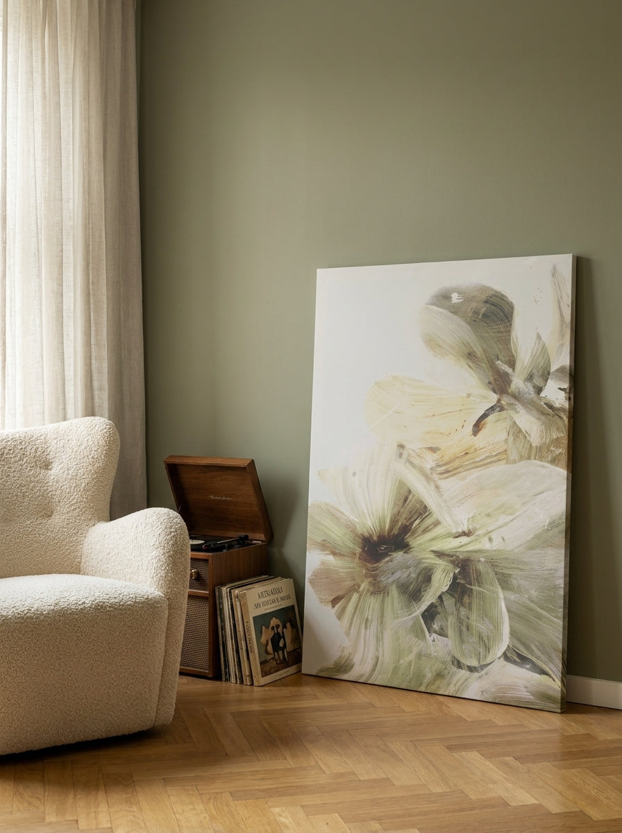 Stretched canvas wall art leaning against the wall in a mid-century dining room