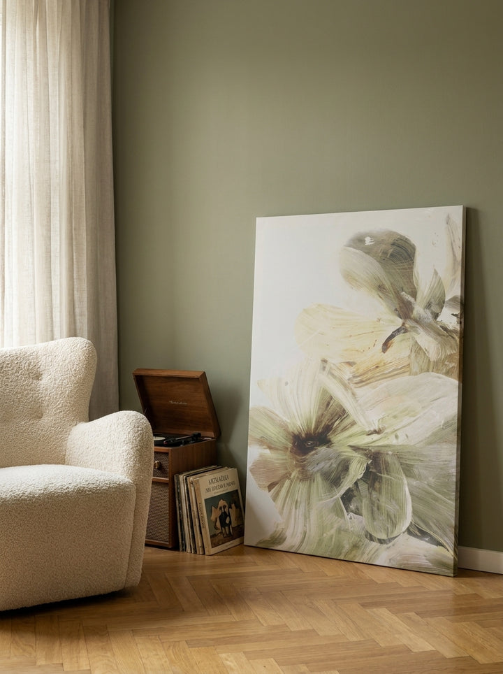 Stretched canvas wall art leaning against the wall in a mid-century dining room