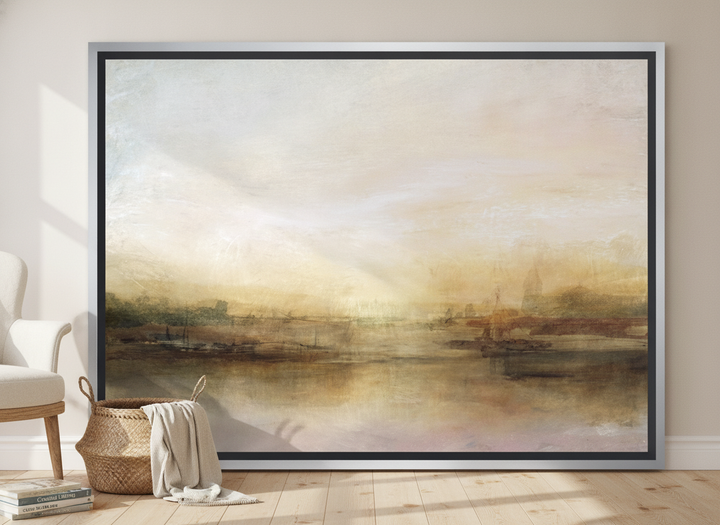 Oversized statement canvas wall art with a silver leaf surround leaning against the wall in a coastal dining room