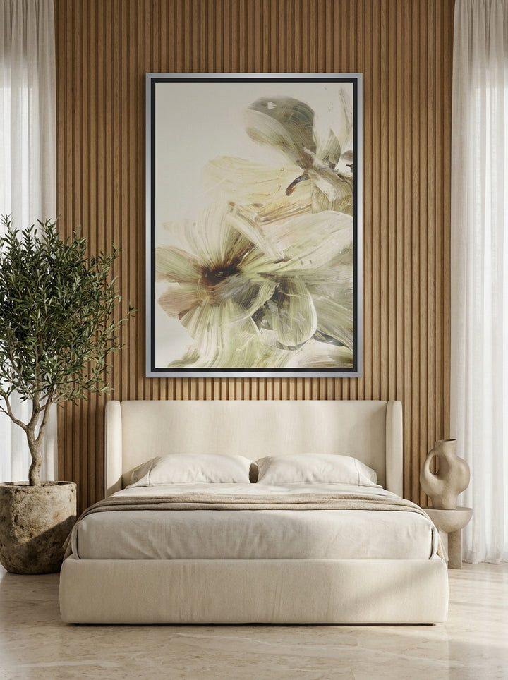 Canvas wall art with a silver leaf surround styled on the wall in a luxe bedroom