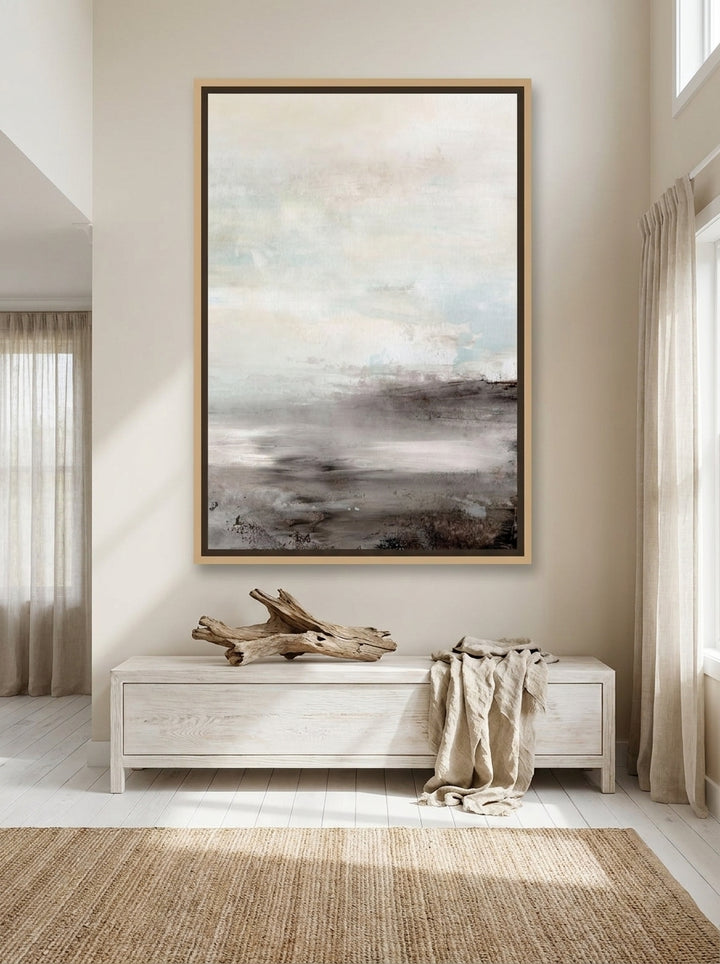 Oversized statement canvas wall art with a natural timber surround styled on the wall in a coastal living room